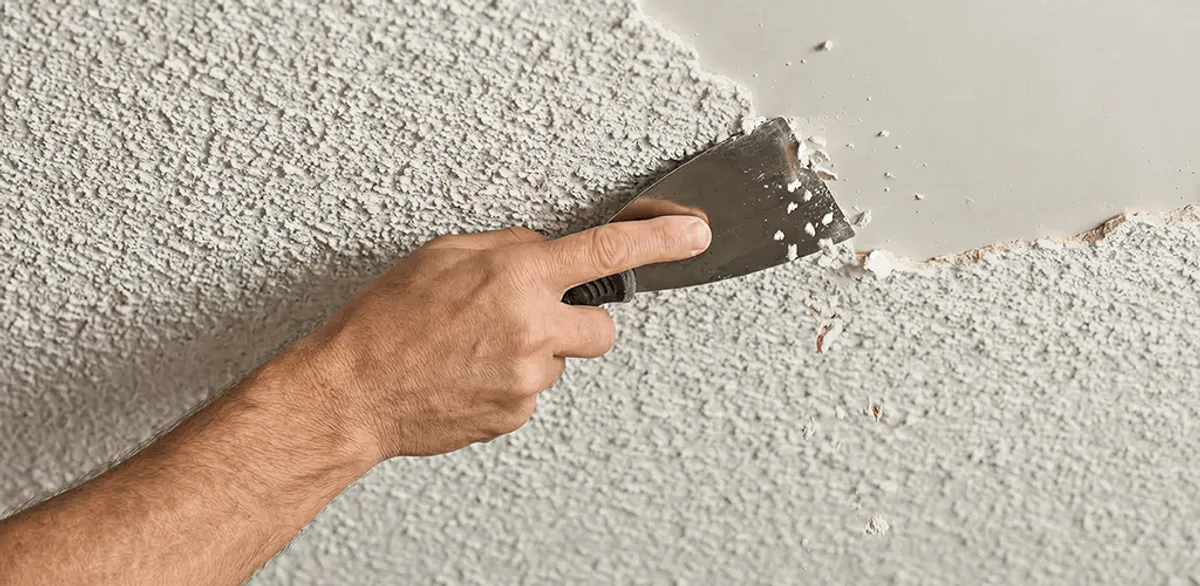 Popcorn ceiling removal scraping off textured ceiling finish in Jackson, MS