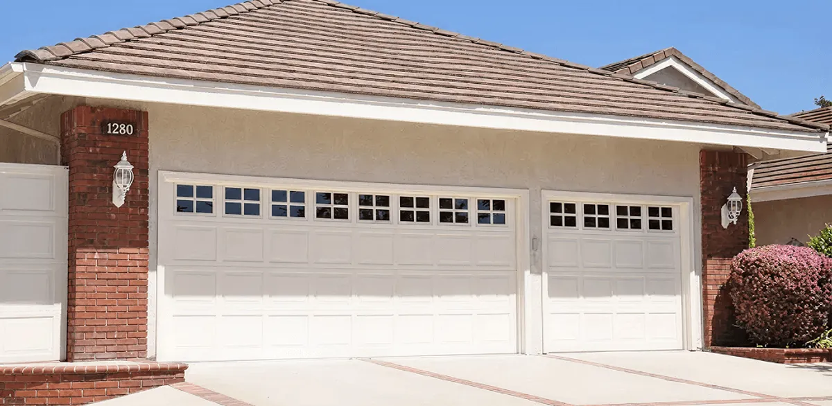Residential garage door repair service for a double garage door in Jackson, MS